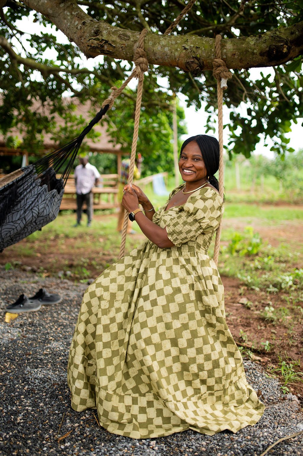A guest smiling on a swing