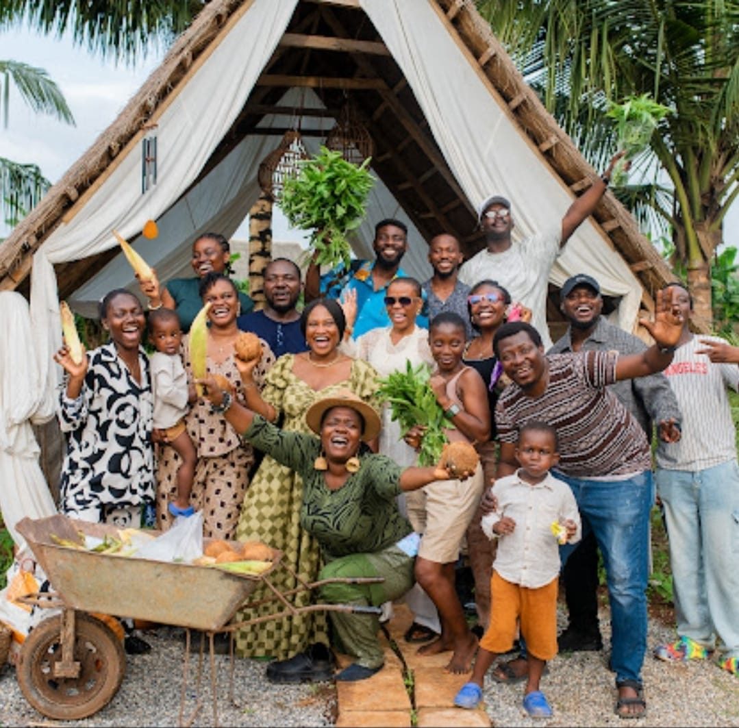 A group gathered in front of a cabin