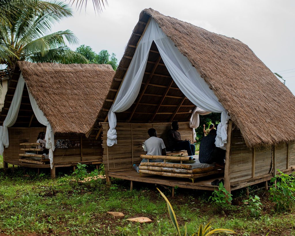 Thatched cabins with white drapes at Ara