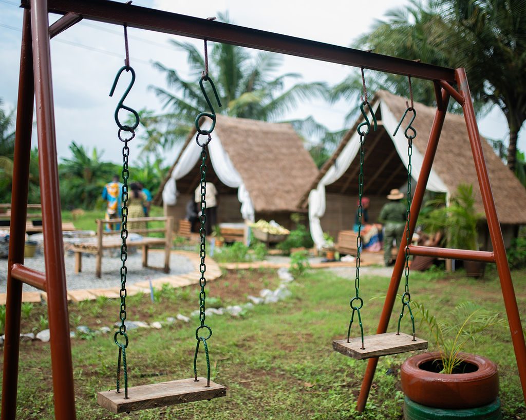 Swings on the lawn in front of the cabins